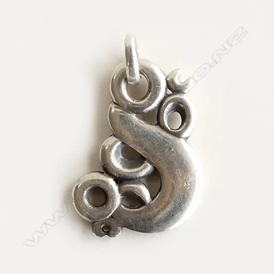 A cast silver handmade taniwha pendant,